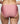 Rear view of a model wearing pink gingham patterned underwear against a light gray background.